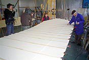 Harald Lohmann inspects the wing fabric covering
